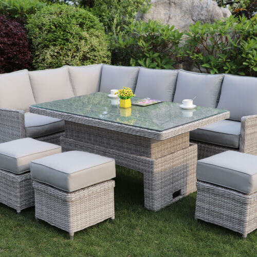 Portavogie Casual Dining Set with Adjustable Table in a light grey rattan with corner soda and foot stools to seat up to 8 people in the garden or patio