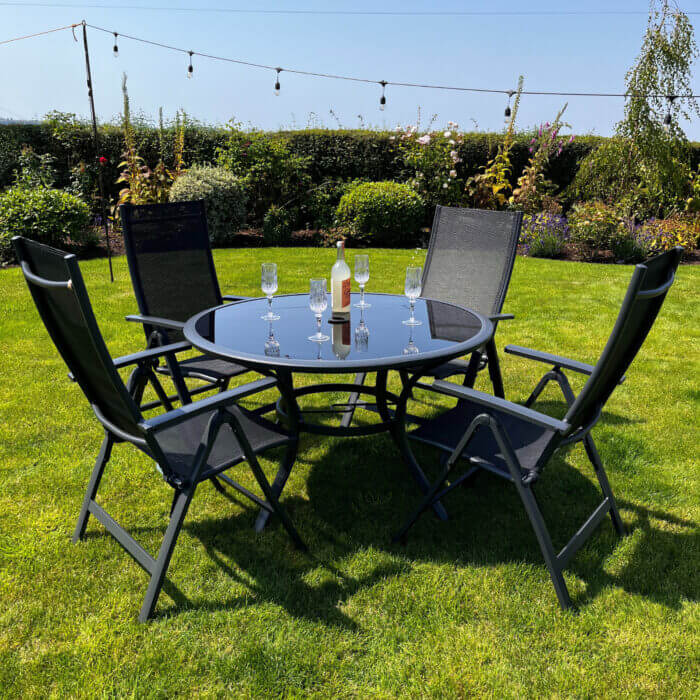 Black metal garden furniture dining set with 4 reclining chairs