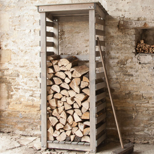 lifestyle image of spruce wood log holder or rack for beside fireplace or fire pit at home