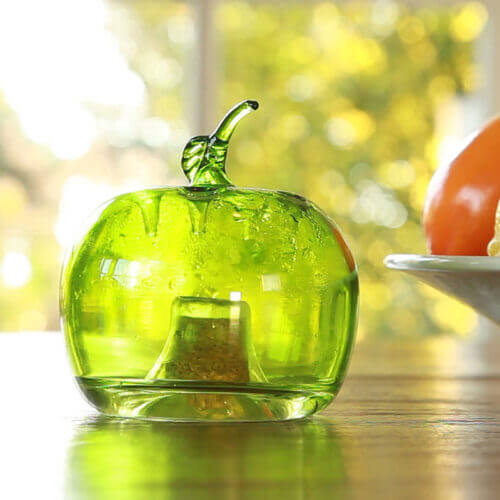 green fruit fly trap for your kitchen to trap flies in your home displayed in a kitchen setting