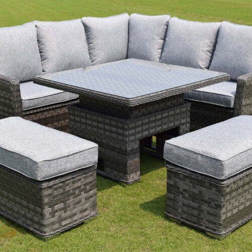 Crawfordsburn small casual dining garden furniture set with corner sofa and adjustable table in a light grey rattan with shower proof cushions and tempered glass table top in the garden for outdoor dining or lounging