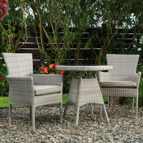Glenarm Bay 2 seater bistro dining set for the garden in a beige rattan and tempered glass table top for the garden or patio area