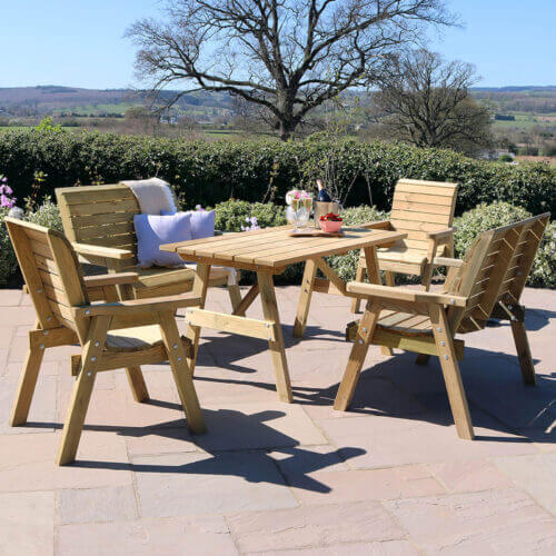 Charlotte Wooden 4 Seat Rectangular Dining with 2 2-seater sofas, 2 armchairs and a rectangular dining table with parasol fitting to enjoy in the garden or patio this summer